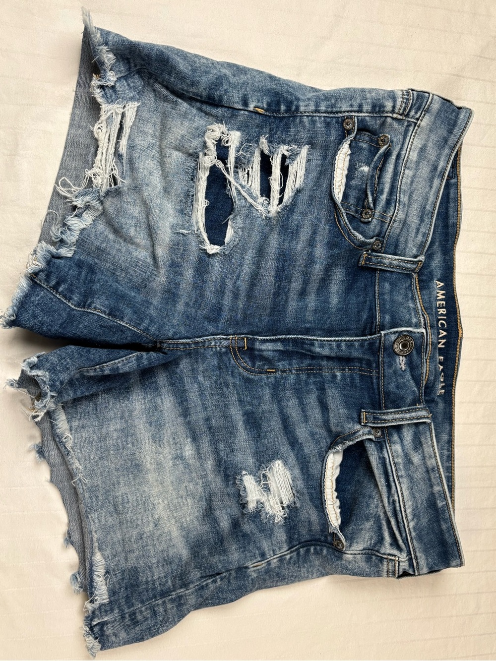 American Eagle Outfitters women’s 14 midi Light Blue Distressed Denim Shorts